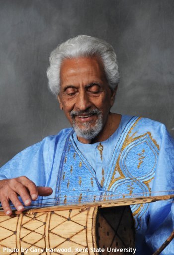 Hal El-Dabh plays instrument